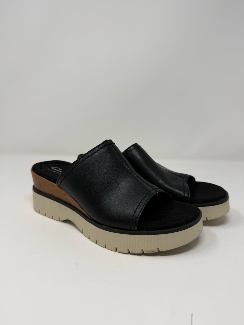 Clarks Black Slide Mules with Cream Platform and Wood Accent